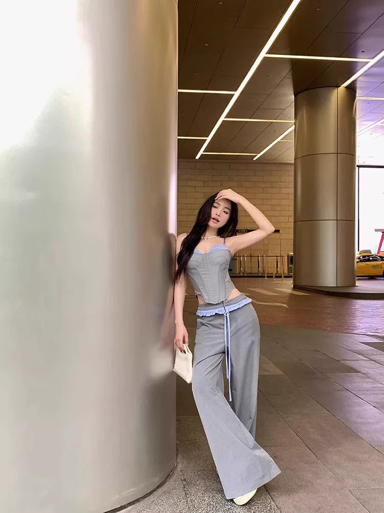 Sanhoostudio halter camisole top designed with a ribbed structure and built-in padding. A versatile piece for layering or standalone streetwear looks.