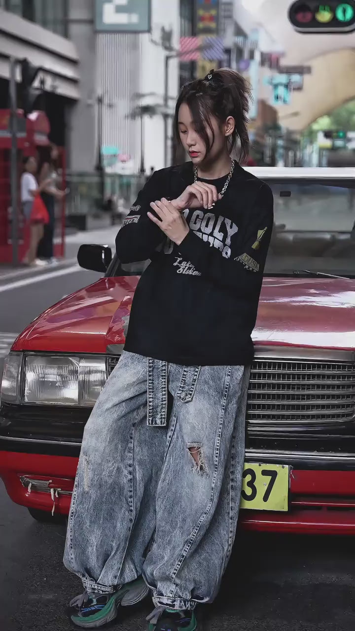 Retro-inspired wide-leg jeans featuring lantern-style drape and distressed cutouts. A unique American vintage streetwear statement.