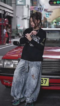 Retro-inspired wide-leg jeans featuring lantern-style drape and distressed cutouts. A unique American vintage streetwear statement.