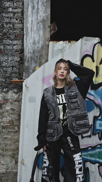 Sanhoostudio utility vest featuring multi-pocket design, distressed wash, and relaxed fit for functional streetwear styling.
