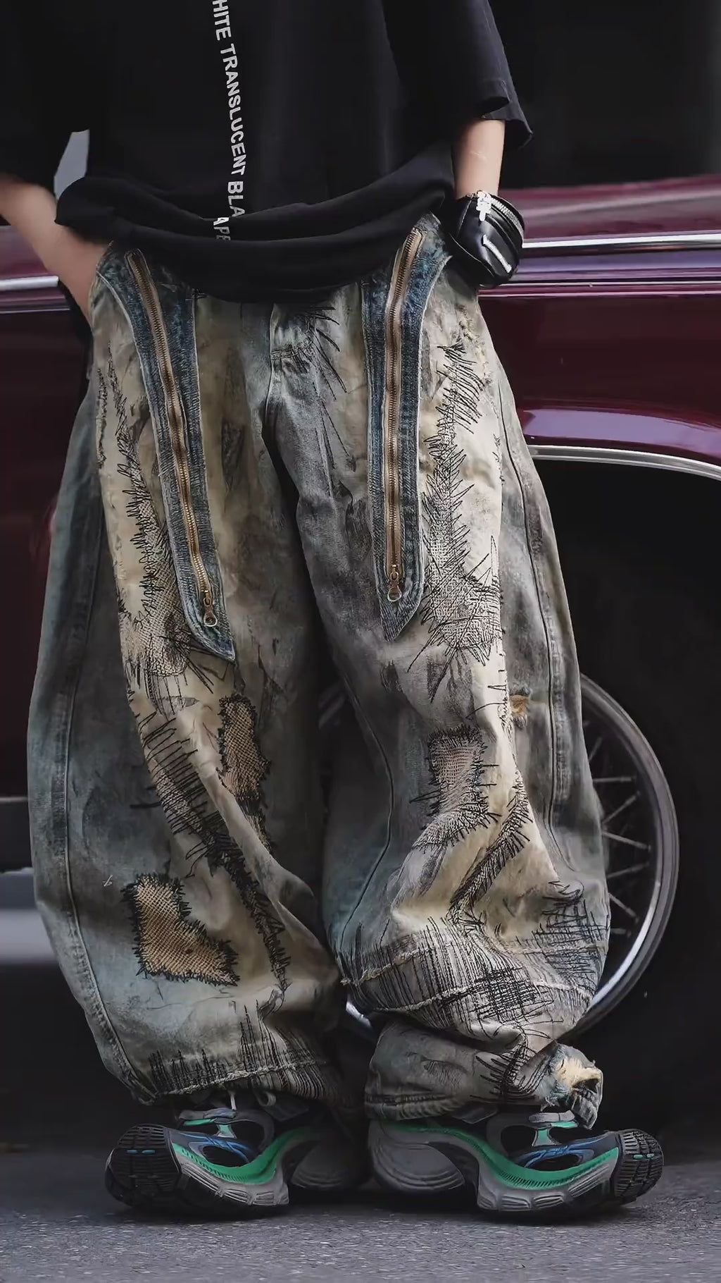 Sanhoostudio wide leg denim pants featuring distressed wash, heavy embroidery, and wasteland-inspired design. Built with a loose fit silhouette for bold streetwear styling.