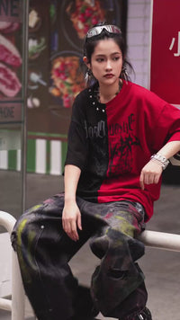 Sanhoostudio short sleeve T-shirt featuring graffiti print, studded details, and colorblock design. A bold streetwear piece built for standout summer outfits with comfort, breathability, and visual impact.