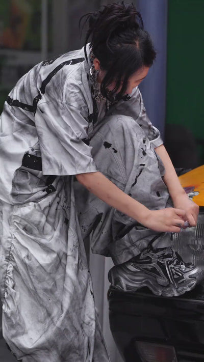 Sanhoostudio short sleeve T-shirt featuring tie dye finish, graphic print design, and relaxed fit silhouette. Designed for modern streetwear outfits with breathable comfort, bold visual appeal, and versatile everyday wear.