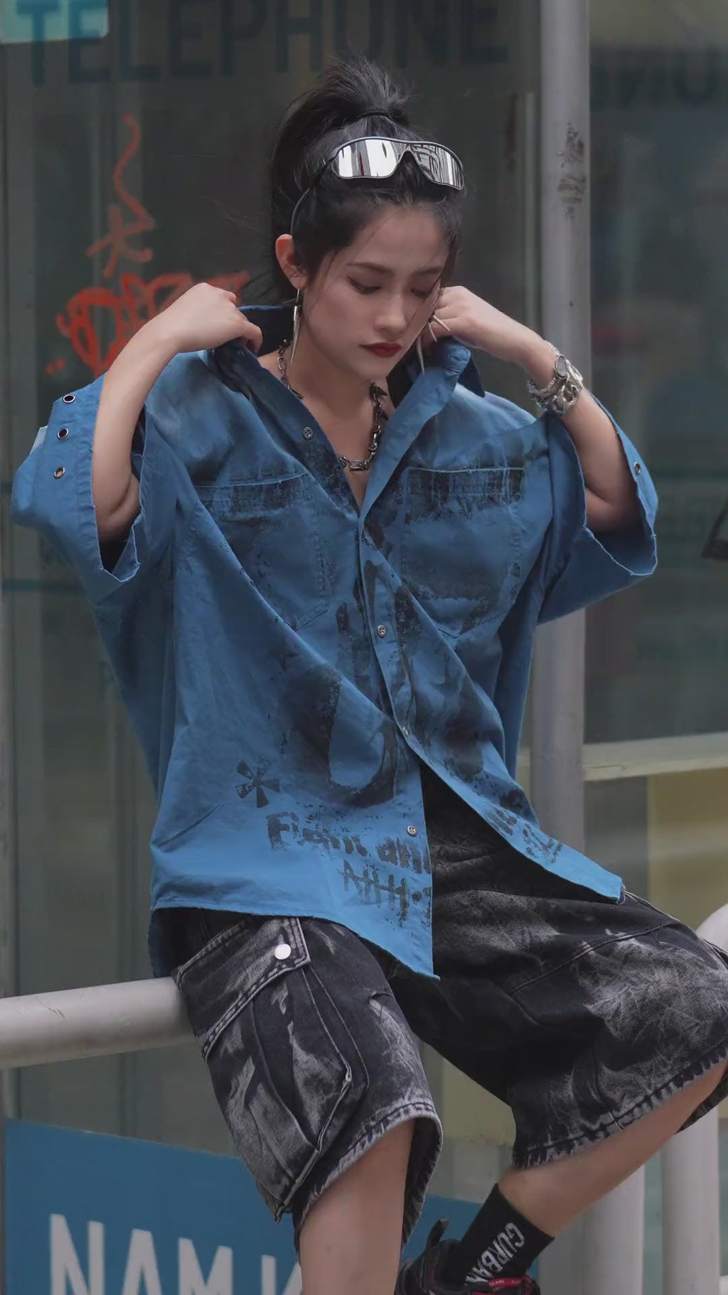 Sanhoostudio short sleeve shirt featuring graffiti print, distressed finish, and relaxed fit silhouette. Designed for modern streetwear styling with breathable fabric and versatile everyday wear.