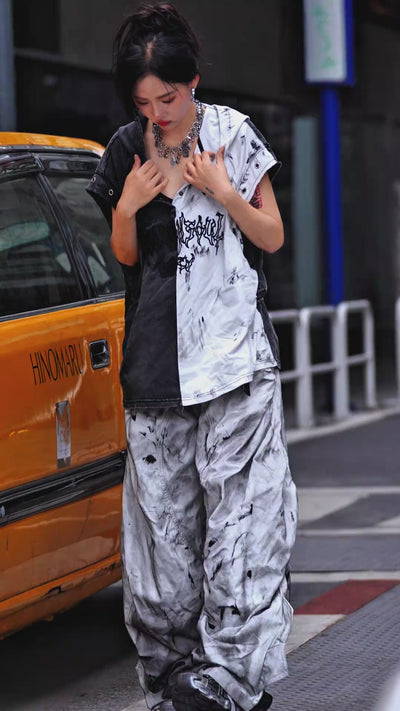 Sanhoostudio wide leg denim pants featuring distressed wash, embroidered detailing, and scythe-cut silhouette. Designed for bold streetwear styling with comfort, durability, and everyday versatility.