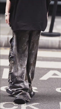 Sanhoostudio wide leg cargo pants featuring distressed wash, paint splatter details, and multi-pocket design. Built for functional streetwear styling with durability, comfort, and bold urban aesthetics.