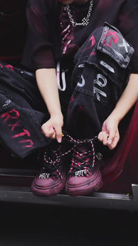 Sanhoostudio dark red T-shirt featuring spray dye effect and lace-up design. A unique streetwear piece combining bold color and artistic detailing.